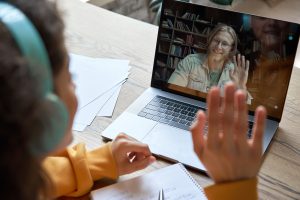 Teen with autism virtually learning with her teacher on Zoom. She gets online autism therapy in California with autism therapist Lauren Perez at Open Doors Therapy 94302