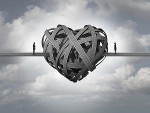 A graphic of a heart made of a tangled road with a couple on either side of the road. This could represent the isolation a neurodiverse couples therapist in Palo Alto, CA can help partners overcome. Learn more about individual relationship therapy for neurodiverse partners in Illinois by contacting a neurodiverse coach today.